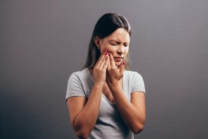 image of a woman unhappy about a chipped or cracked tooth